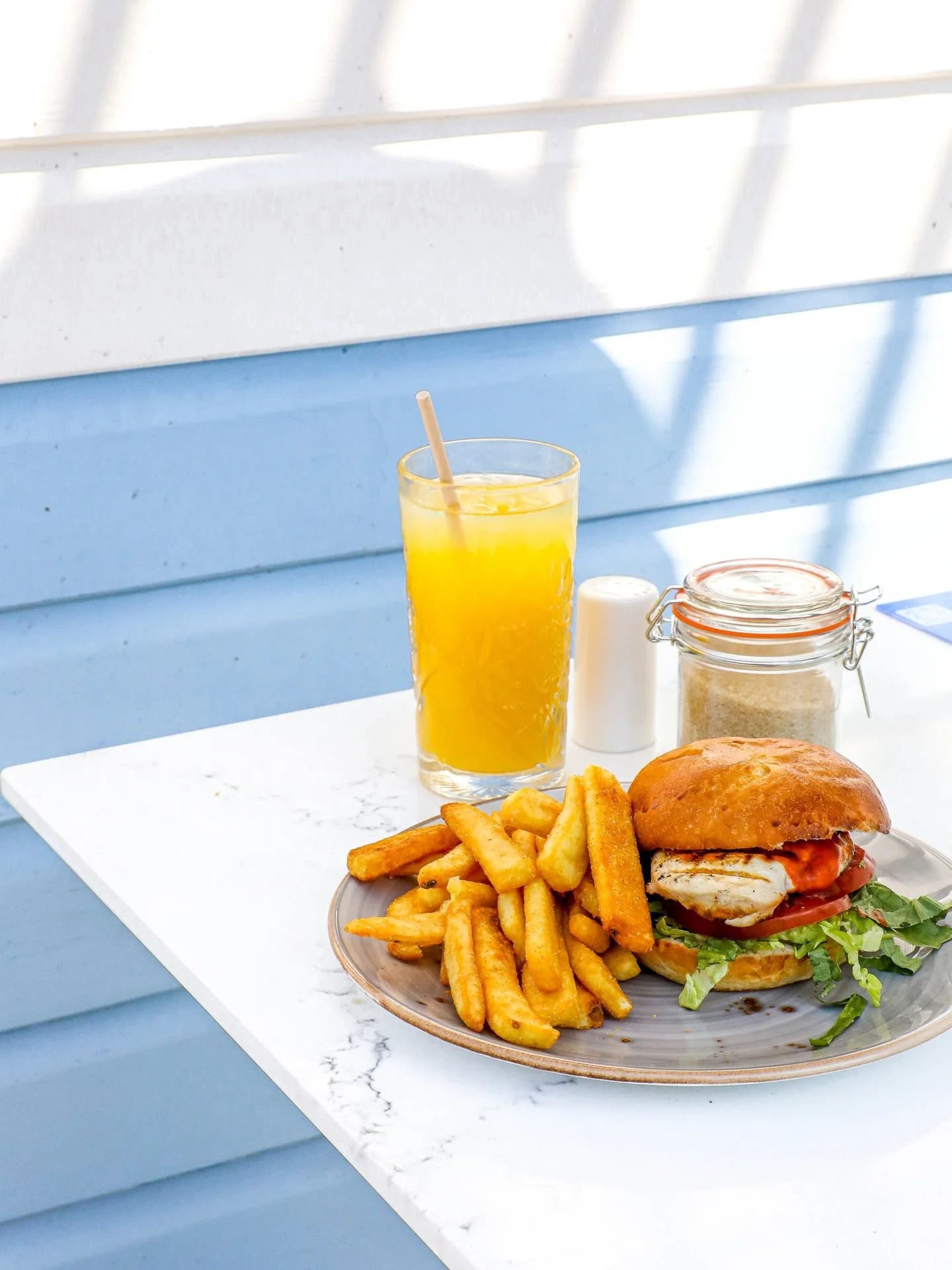 Burger, chips and fresh orange juice