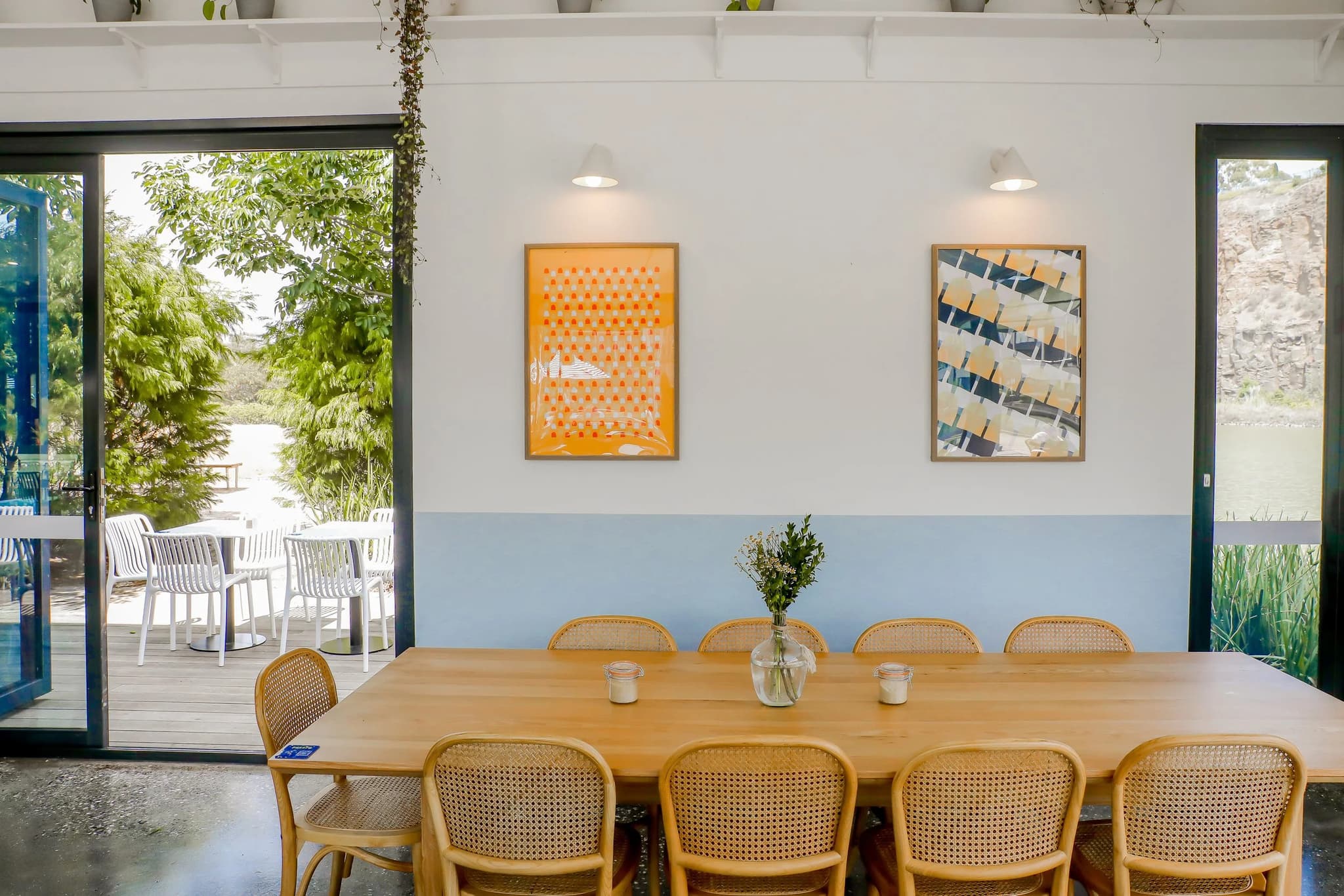 A long timber table set for a group meal